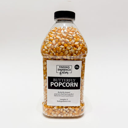 Bottle of butterfly popcorn with black screw top lid. 